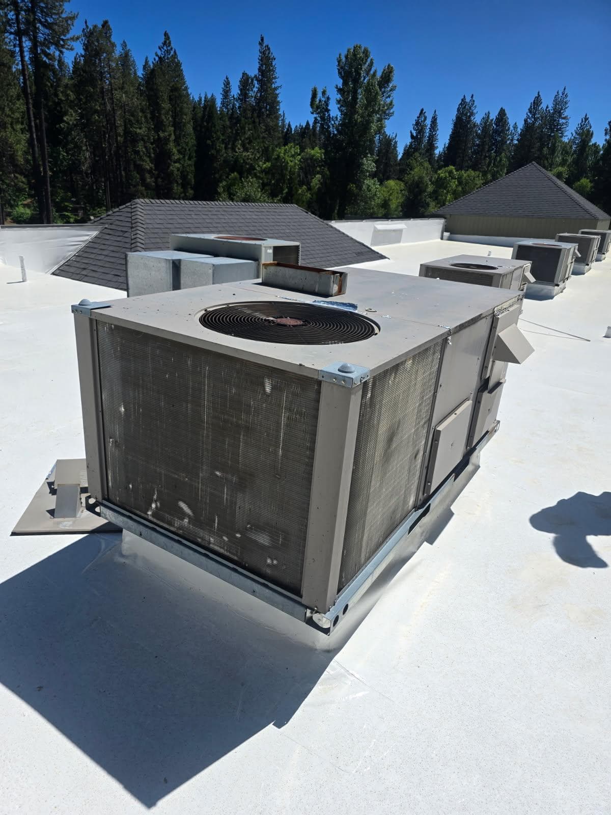 Aging rooftop package unit replaced with a new Daikin unit — before