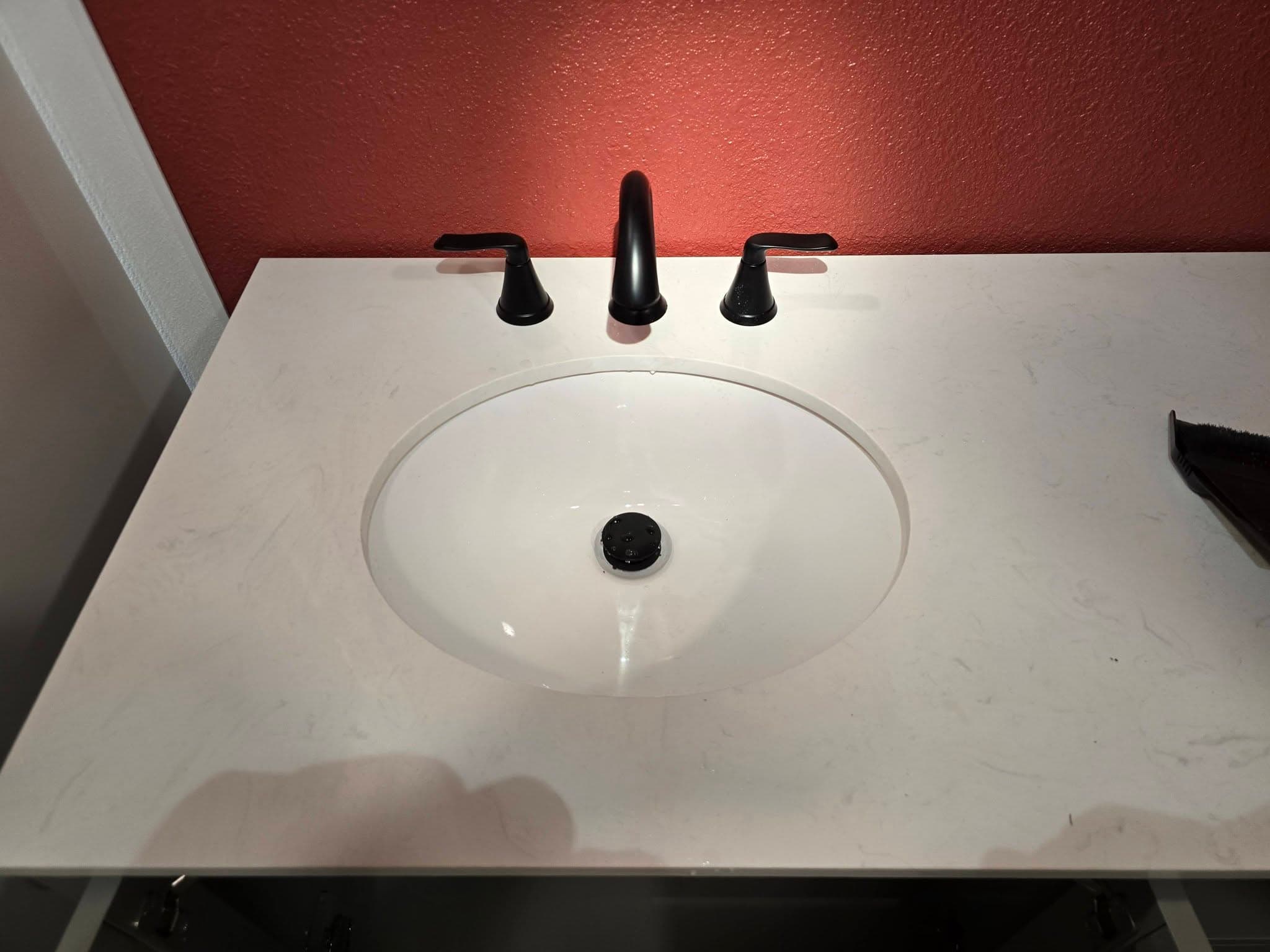 New faucet and fixtures installed on a bathroom vanity